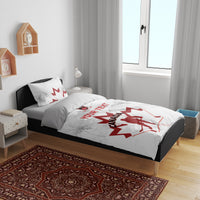Canada hockey bedding set in room: white duvet with black side accents and red maple leaf goalie print