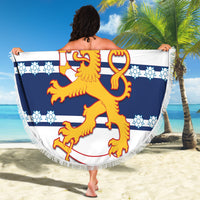 Round Finland hockey beach blanket with fringe, blue-and-white lion crest design