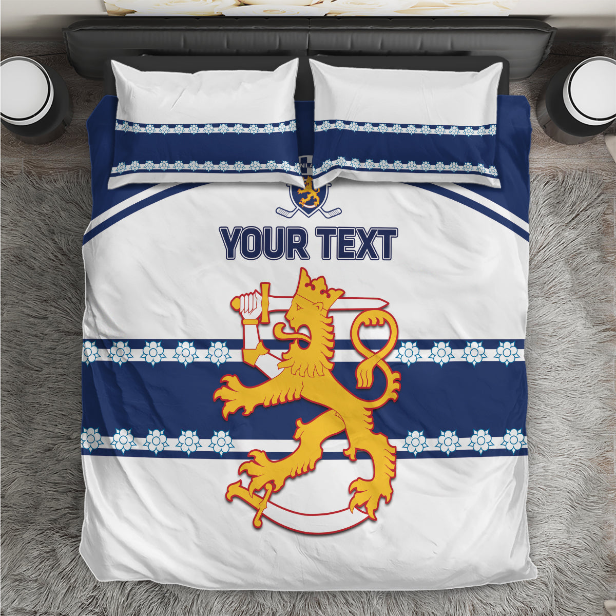 Hockey bedding set close-up: white duvet with blue border, lion logo, and “YOUR TEXT.”
