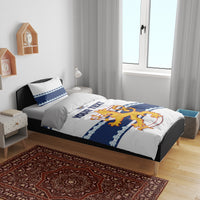 Hockey bedding set in bedroom: white duvet with blue border and lion graphic with “YOUR TEXT.”