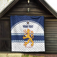 Blue and white quilt with quilted diamonds, lion crest emblem, “YOUR TEXT” design