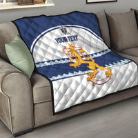 Blue and white quilt throw with quilted pattern, lion crest, and “YOUR TEXT”