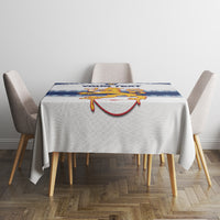 Custom hockey tablecloth with blue-and-white stripe panel and lion crest on dining table