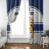 Blue and white hockey curtain panels with crest and custom text by a window