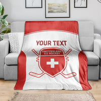 Red and white hockey blanket with Your Text and Switzerland Ice Hockey emblem on sofa