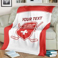 Red and white personalized hockey blanket draped on chair with Your Text and shield