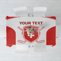 Red and white custom tablecloth with Swiss crest, hockey sticks, and central graphic