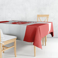 Red and white hockey-themed tablecloth draped over a dining table with bold red bands