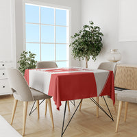 Red and white hockey tablecloth on a dining set with printed Swiss-themed design