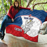 Custom Czech hockey quilt held outside in blue, white, and red with crest and “YOUR TEXT”.