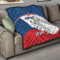 Custom Czech hockey quilt on sofa in blue, white, and red with crest and “CESKO”.