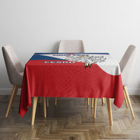 Red, blue, and white hockey tablecloth covering a round dining table