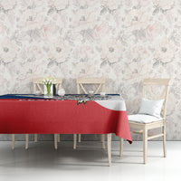 Red, blue, and white Czech hockey tablecloth on dining table in front of wall
