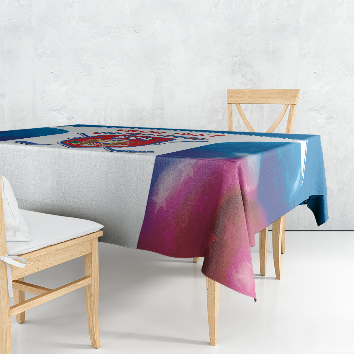 Blue and white custom hockey tablecloth draped over dining table with logo