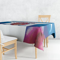 Blue and white custom hockey tablecloth draped over dining table with logo