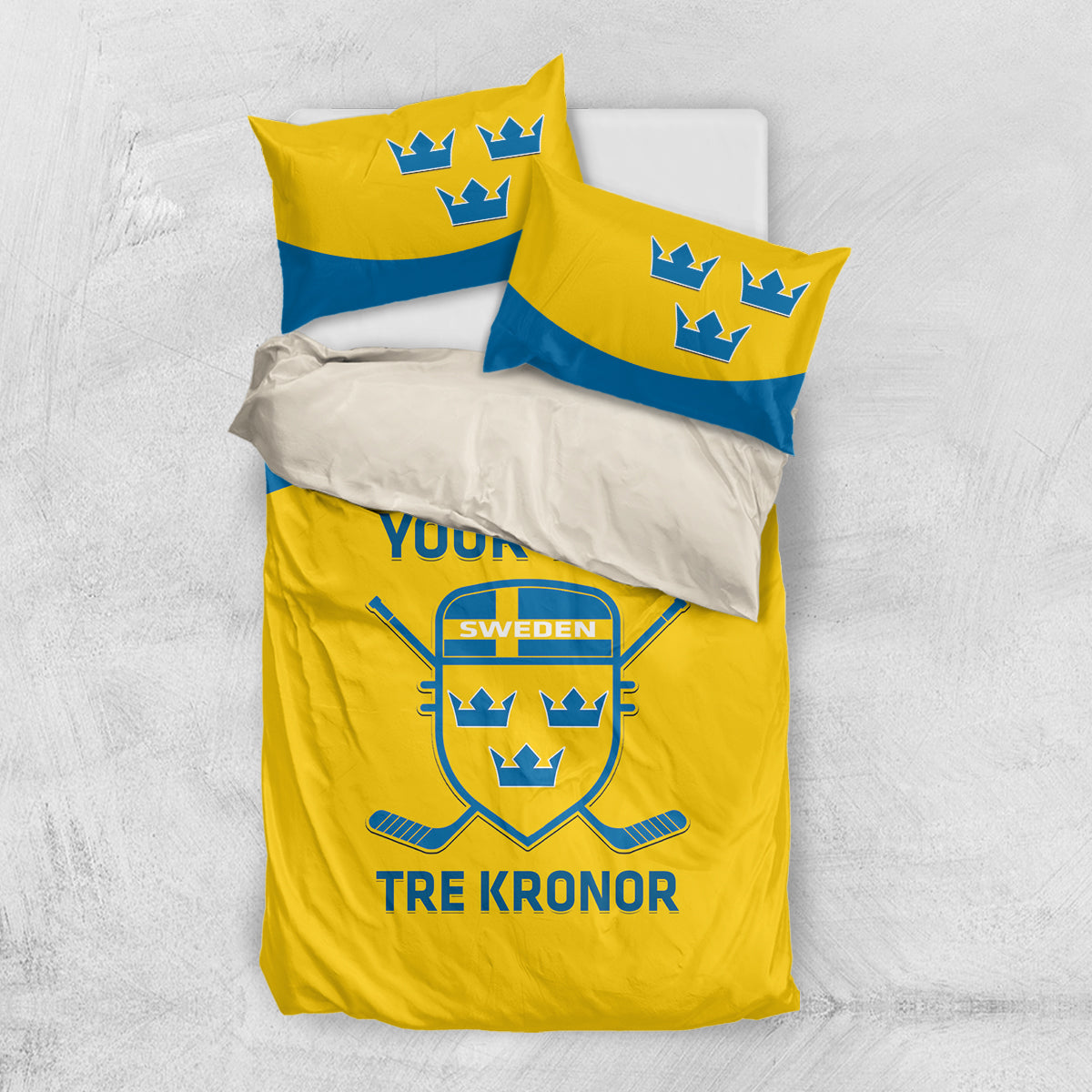 Yellow and blue duvet and pillow covers with Sweden crest and 'Tre Kronor' print