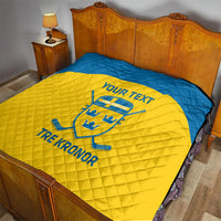 Custom Sweden hockey quilt on bed, blue and yellow design with Sweden crest and text