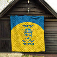 Custom Sweden hockey quilt hanging at doorway, blue border and yellow center with crest