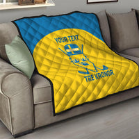 Custom Sweden hockey quilt on sofa, blue top and yellow center with Sweden crest