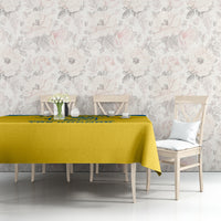 Yellow tablecloth with blue logo stripe on dining table, 'Tre Kronor' centered