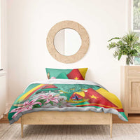 Green duvet and pillow set with Cameroon flag design, lion emblem, monument and pink lilies