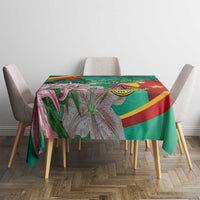Multicolor tablecloth with green background and pink floral pattern on dining table
