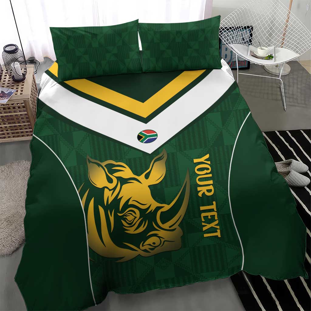 Green bedding set showing gold rhino graphic, yellow lettering, white chevron border, two shams