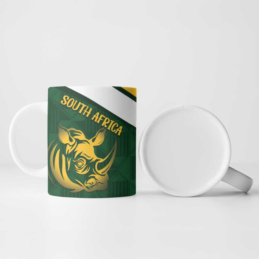 Green ceramic mug with gold rhino face and “SOUTH AFRICA” text