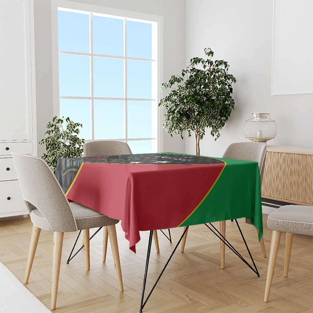 Cricket tablecloth draped over dining table, red and green panels with black edge