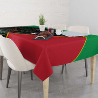 Cricket tablecloth corner drape on table, red main panel with green edge trim