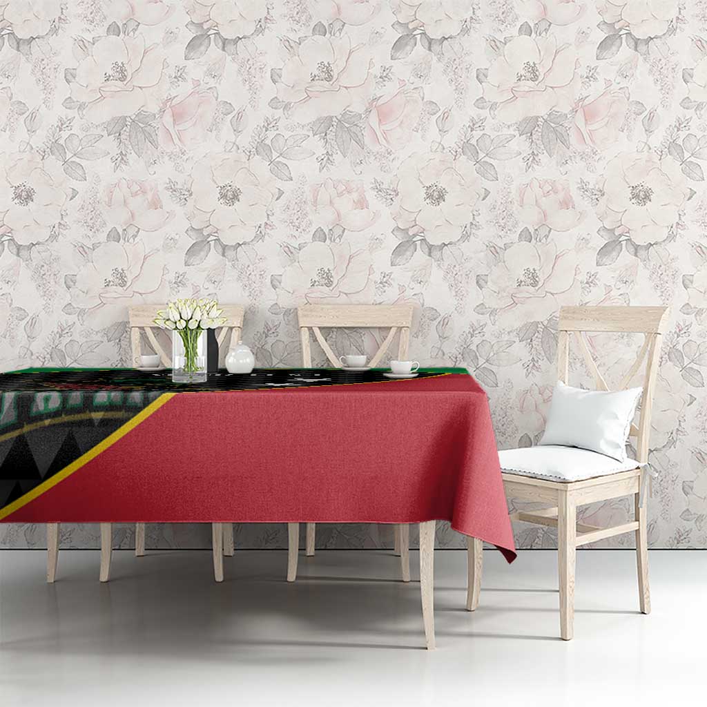 Cricket tablecloth on long table, red top with green border and black patterned end