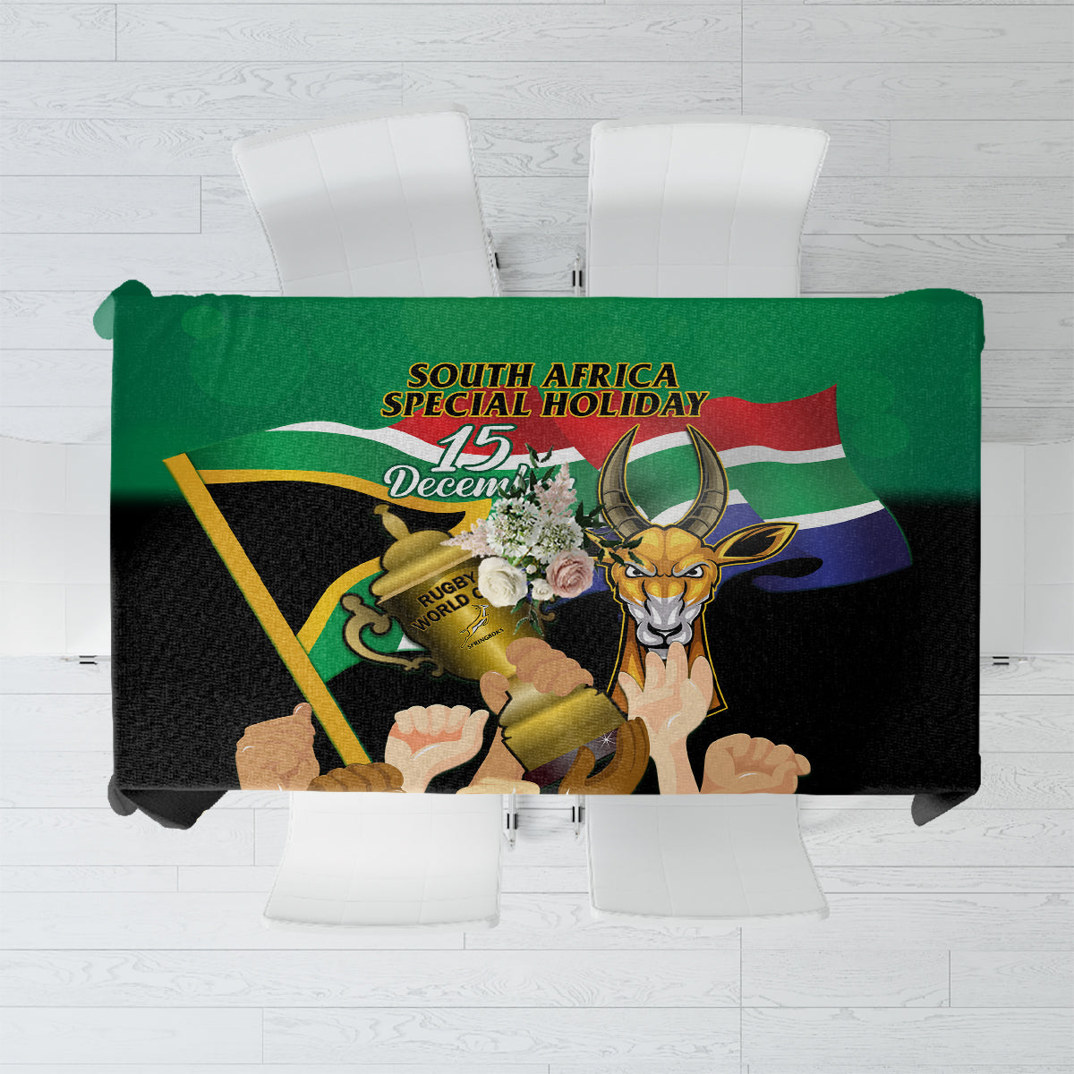 Green tablecloth with Springbok rugby celebration print and South Africa holiday text