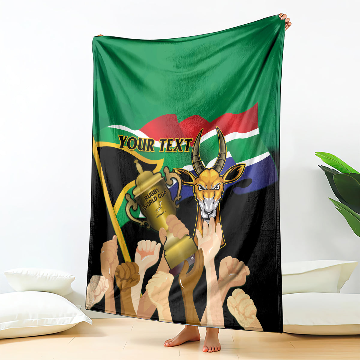 Green and black rugby-themed blanket with springbok graphic and 'YOUR TEXT' ribbon