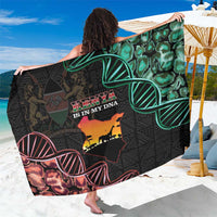 Black Kenya-themed sarong with green map graphic and colorful sunglasses print