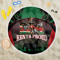 Round beach blanket with fringe, green/black safari animals and 'Kenya Proud' logo