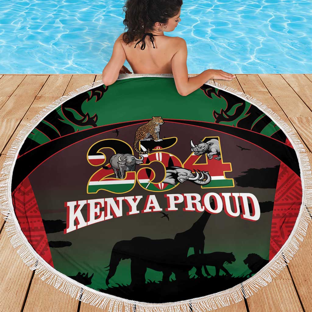 Round fringe beach blanket in green/black with safari animals and 'Kenya Proud' text