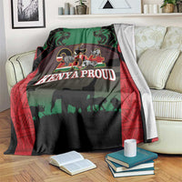 Safari animal blanket over sofa arm; green top with lions, elephants, and red patterned edge