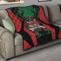 Kenya safari quilt on couch with red and black sides, green center, and lion graphics