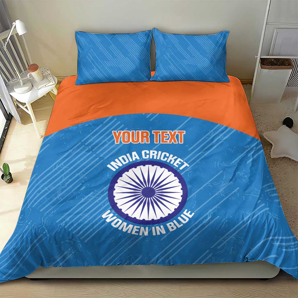 Blue bedding set with orange band, cricket graphic and logo on comforter, two pillowcases