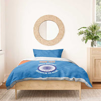 Blue bedding set with orange band and cricket logo on comforter, with two pillowcases