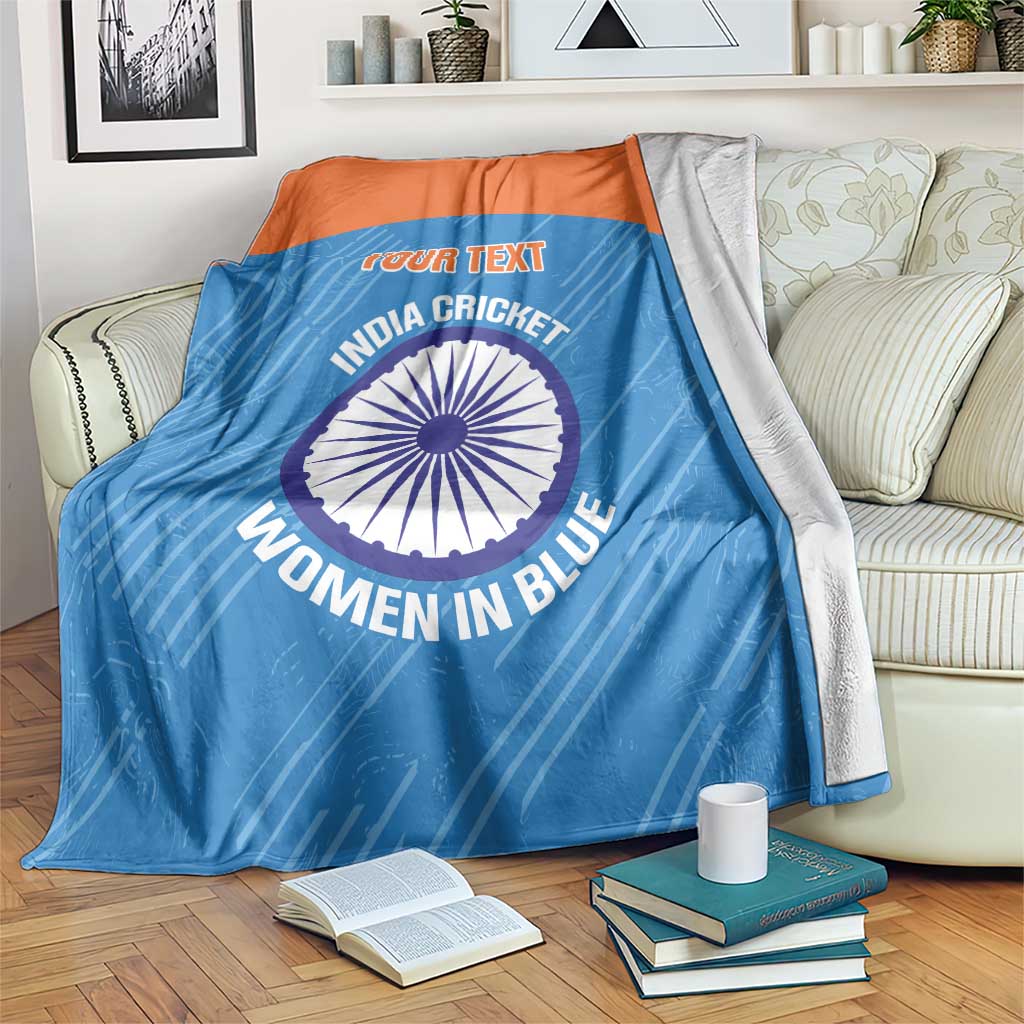 Blue cricket blanket with orange top band, circular India Women in Blue emblem and custom text