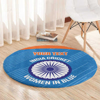 Blue round carpet with orange edge and central cricket emblem, printed “YOUR TEXT”