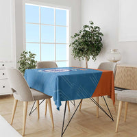 Blue cricket-themed tablecloth with large circular logo and white decorative text