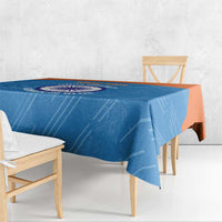 Blue cricket tablecloth with circular emblem across table surface and logo center