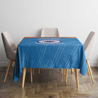 Blue cricket tablecloth featuring central circular emblem and woven-looking pattern