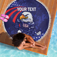 Blue round beach blanket with eagle hockey mascot and USA graphic, white fringe border