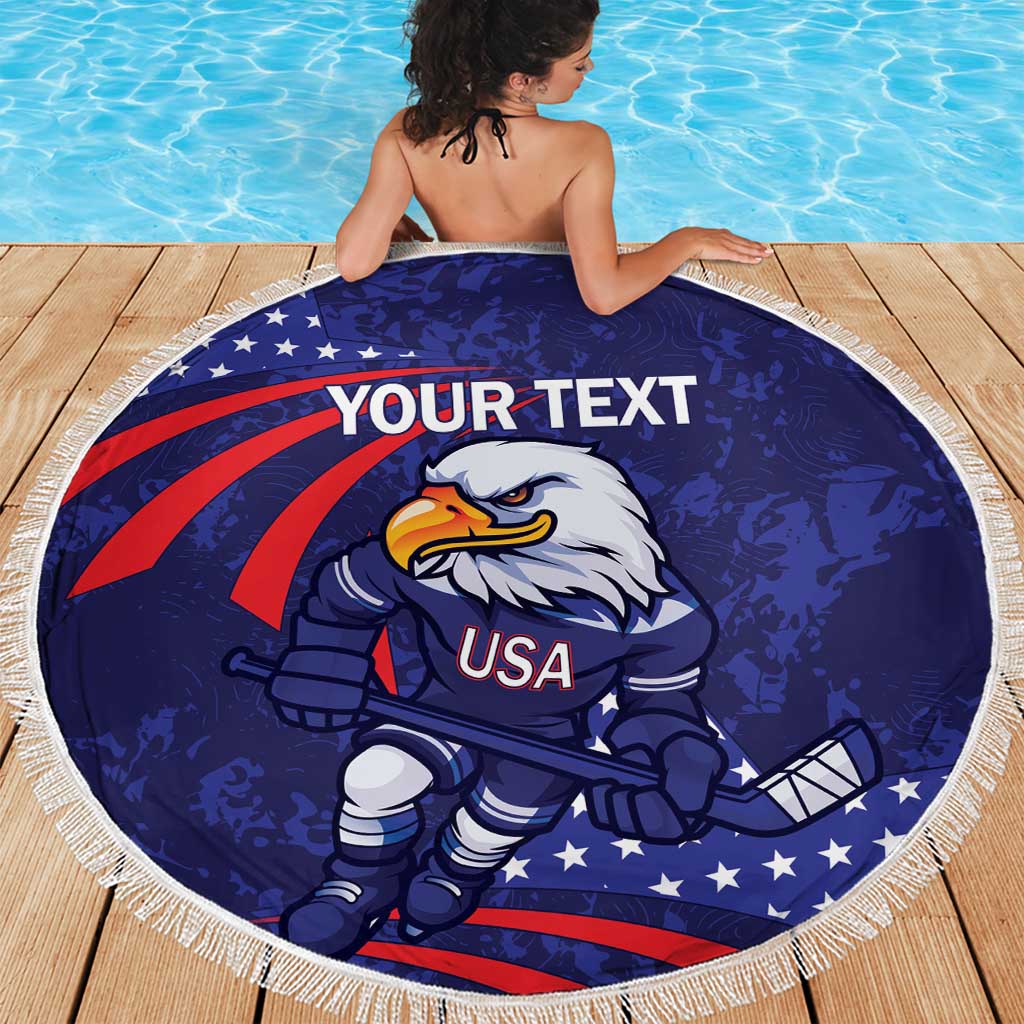Blue round beach blanket with eagle hockey mascot, USA graphic and white fringe border