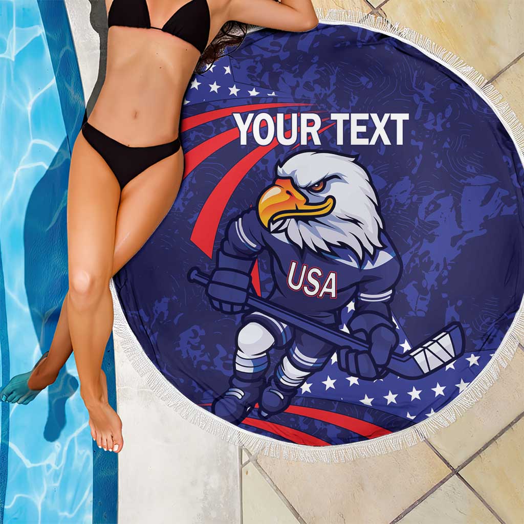 Blue round beach blanket with eagle hockey mascot USA print, white fringe edge by pool