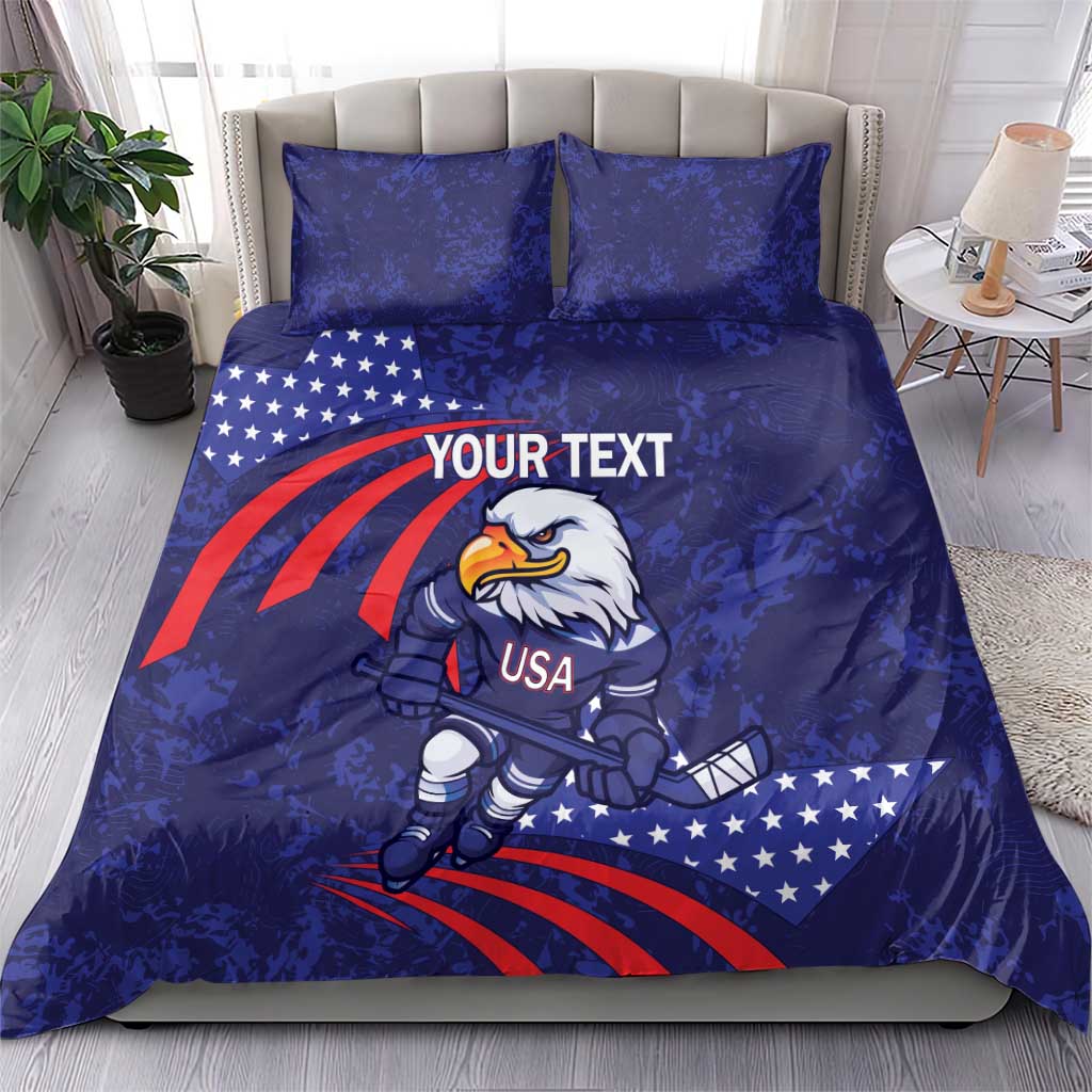 Blue USA ice hockey bedding set on bed with eagle mascot graphic, stars, stripes, and 2 pillows