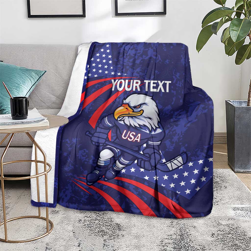 Blue ice hockey blanket on gray sofa, eagle mascot with USA, stars and red stripes, your text